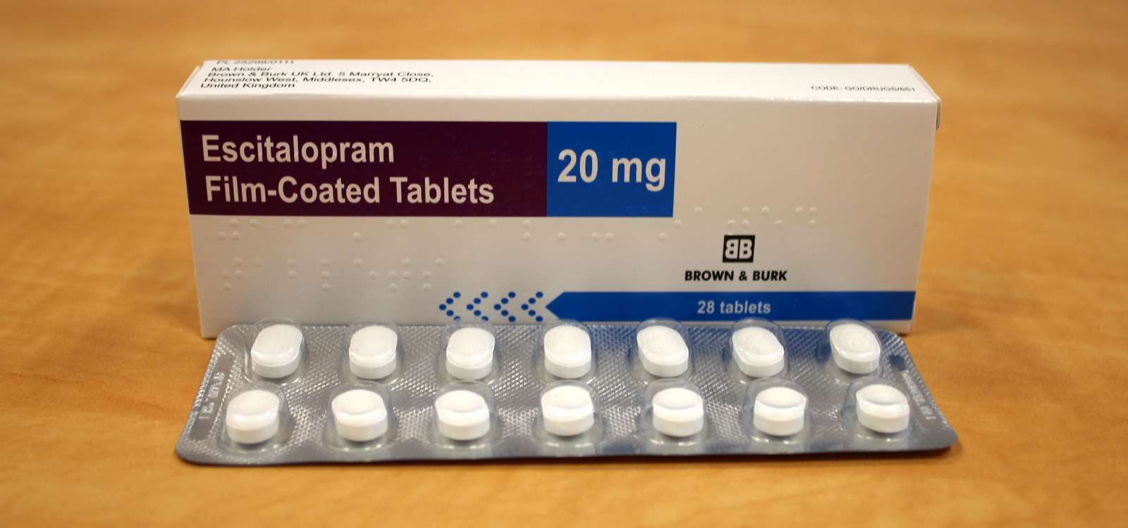 Generic Escitalopram 20mg oral tablets packaging box displaying therapeutic strength next to a silver medicine blister pack